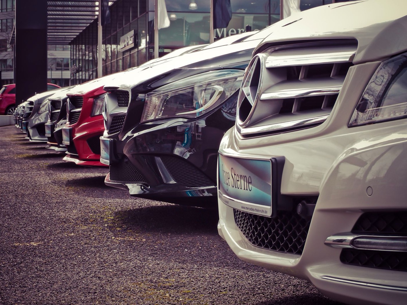 Row of vehicles at a car dealership