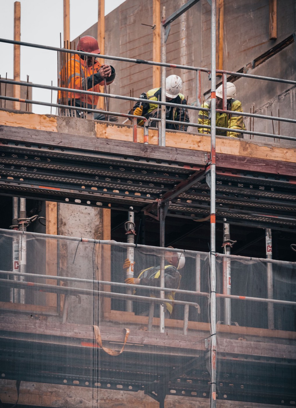Contractor reviewing plans on site